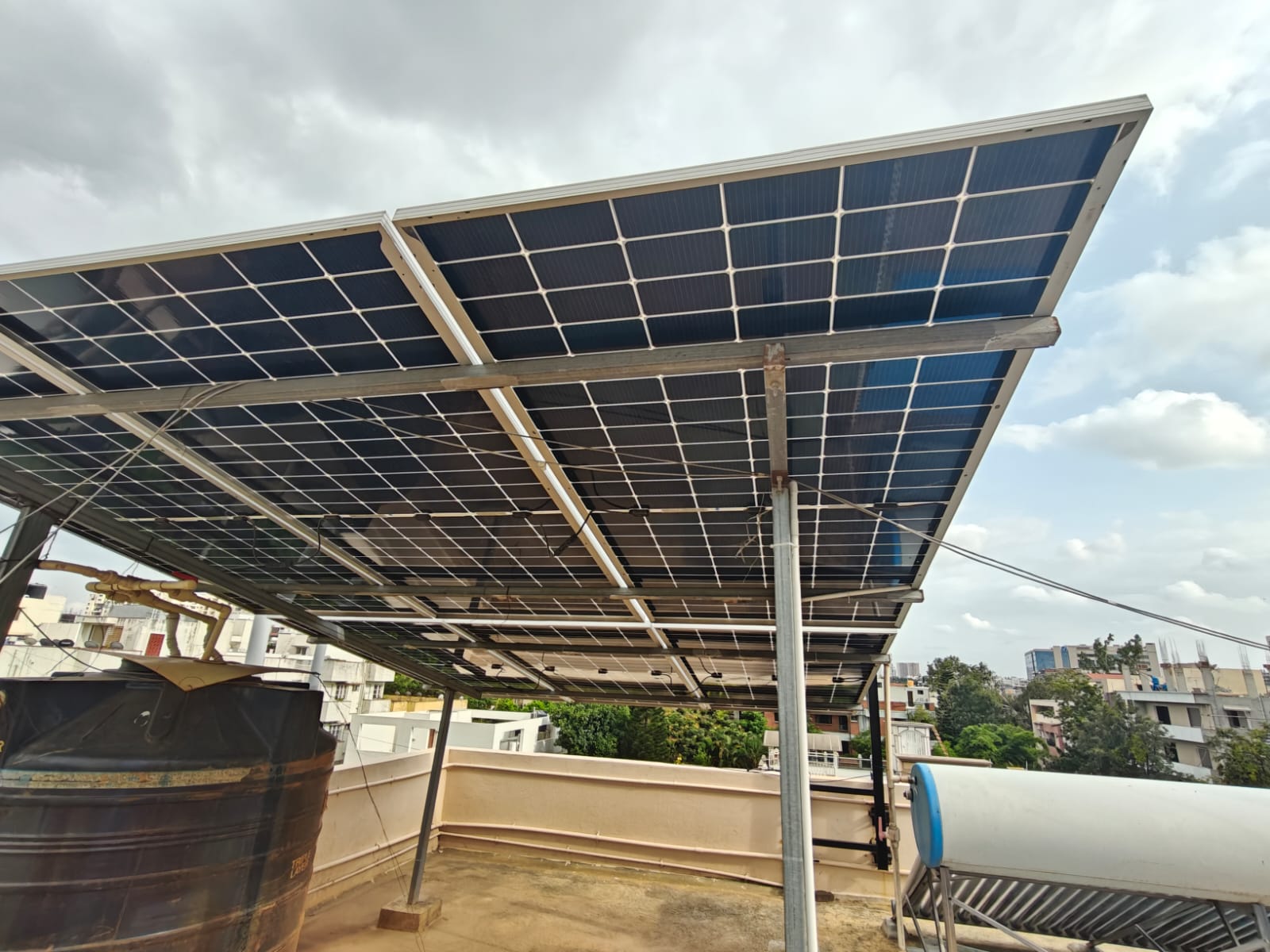 Elevated bifacial solar panels on a home terrace